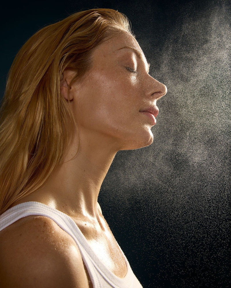 Woman sprayed by mist
